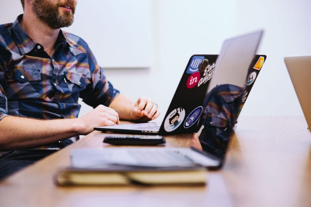 men working on a project management software