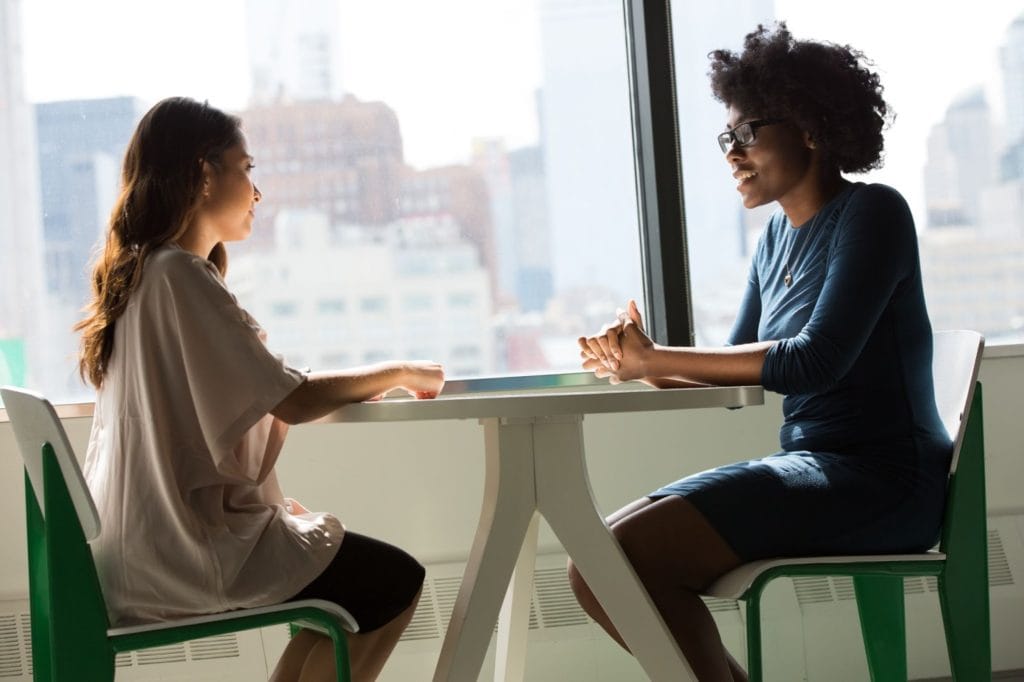 Candidate and recruiter in an interview recruitment questionnaire template