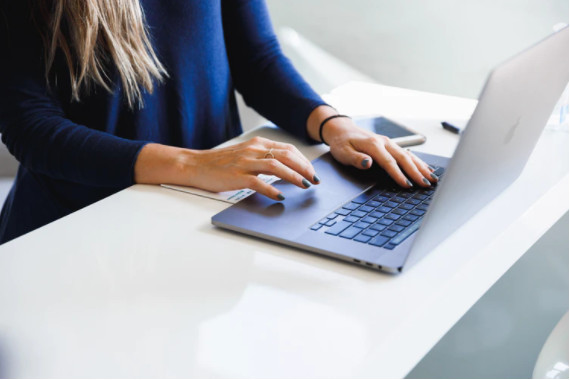 Woman typing keyboard internal company newsletters
