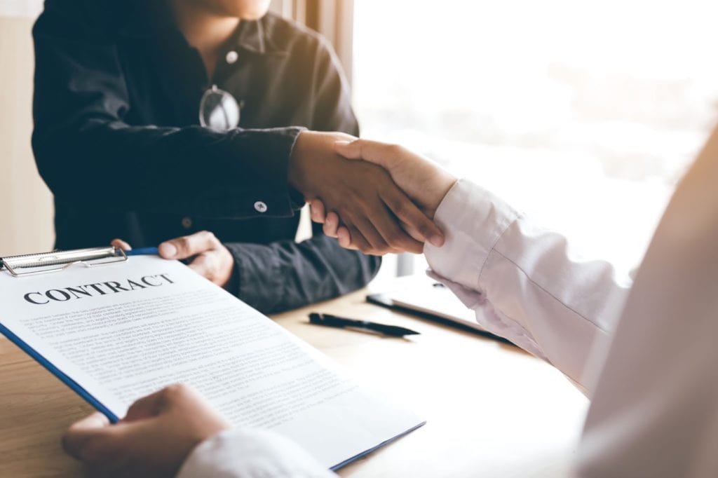 Business people handshake after contract signing