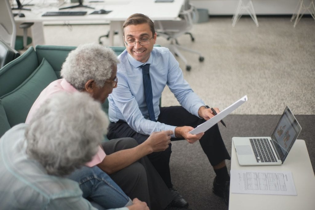 Man in discussion with clients