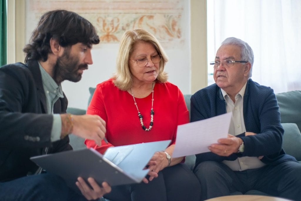 people discussing insurance details