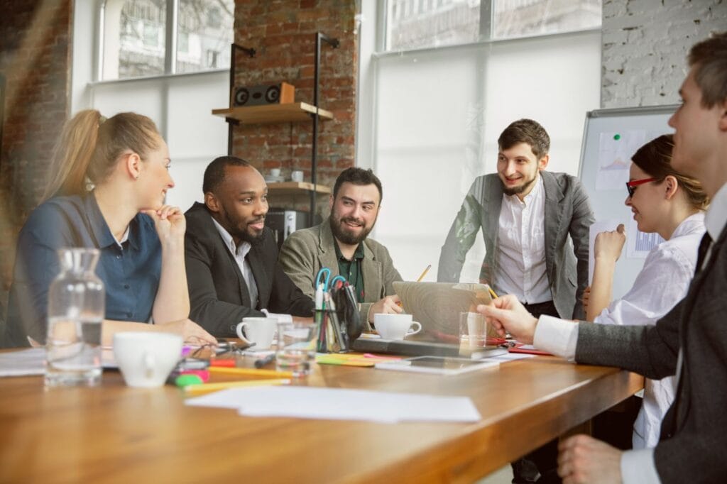 Group of professionals meeting at table