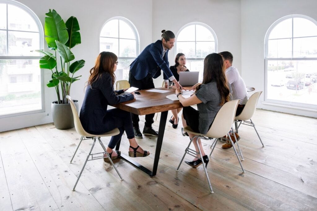 Group of professionals meeting at desk