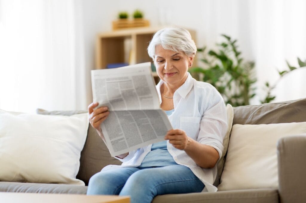 Woman reading newspaper